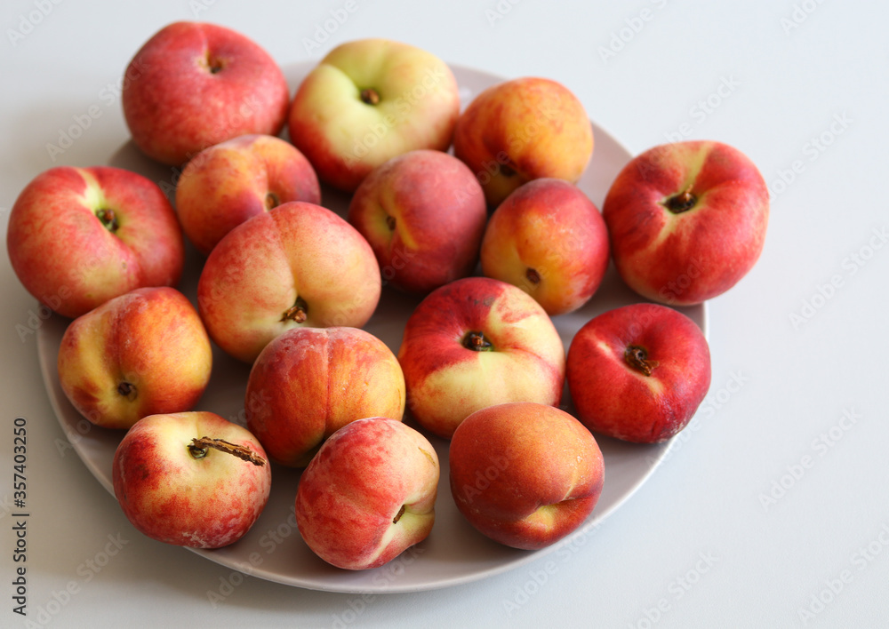 ripe juicy peaches on a white background close up ripe juicy peaches on a white background close up