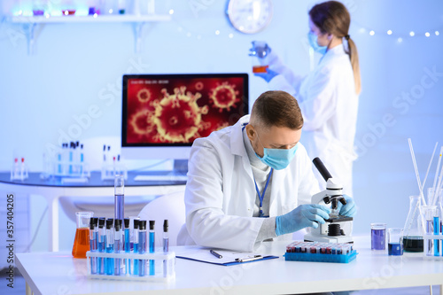 Scientists working with sam...