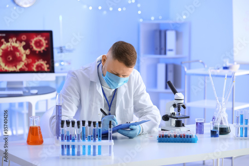 Scientist working with samp...