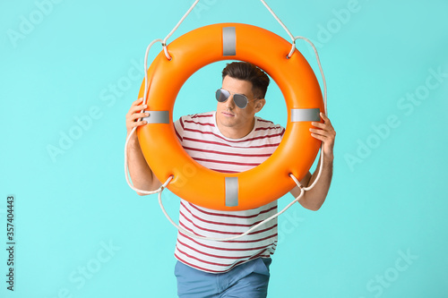 Beach rescuer with lifebuoy...