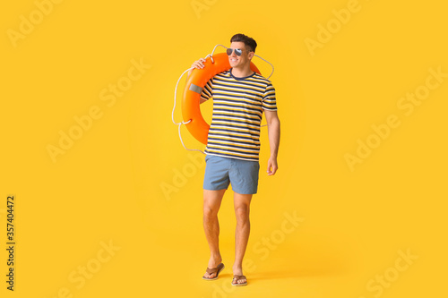 Beach rescuer with lifebuoy...