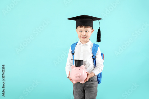 Little boy with piggy bank ...
