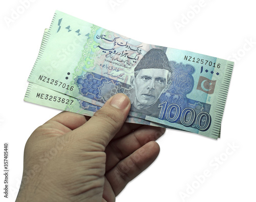 hand hold pakistani currency note