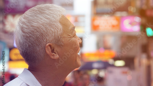 Photography Asian elder senior man happy in Hon gKong might neon