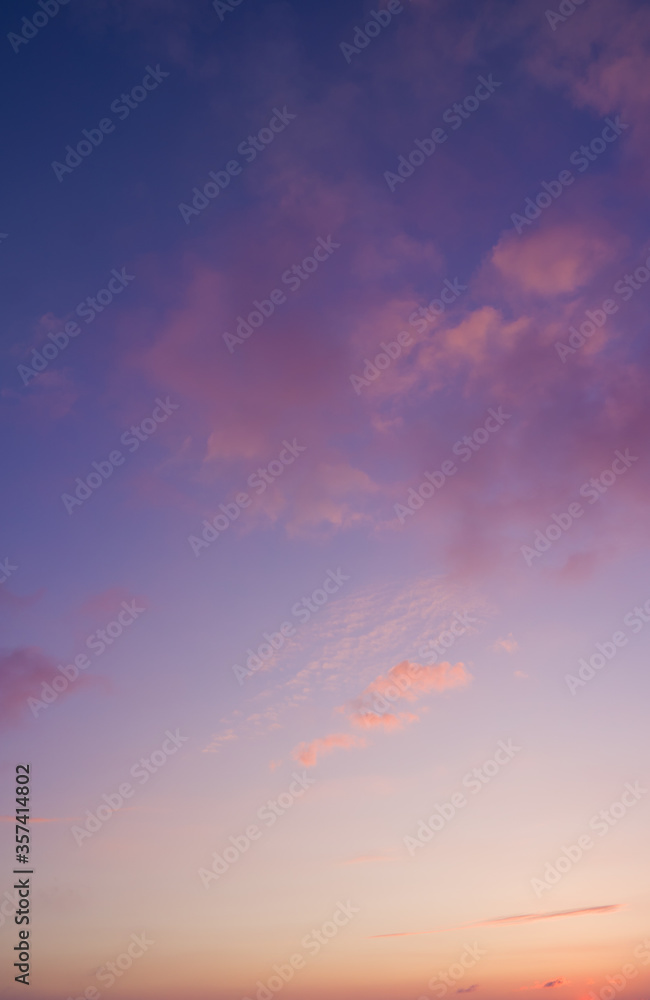 Vertical photo of majestic colorful clouds in pastel tones. Sky and beautiful clouds, heaven.