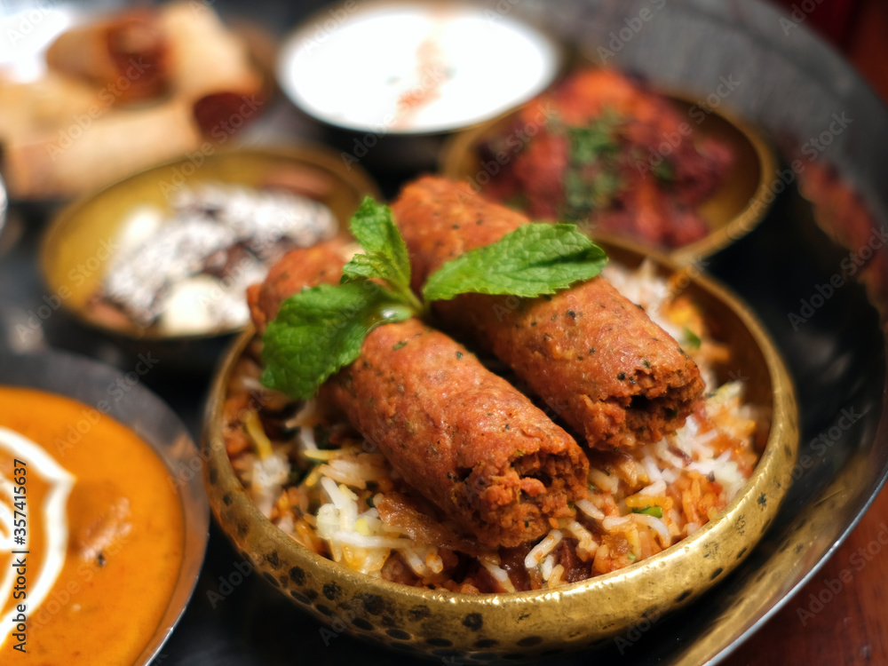 Lamb Kebabs with Biryani and mint leaves