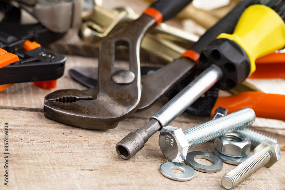 Fototapeta premium Different tools on the old background.