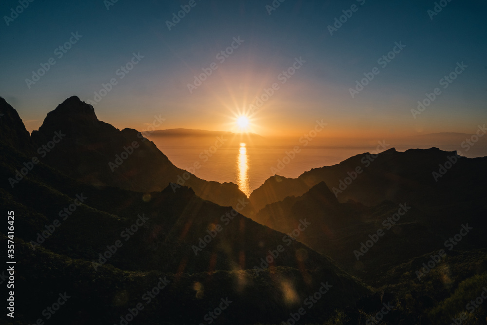 Red sunset over mountains and ocean Red sunset over mountains and ocean