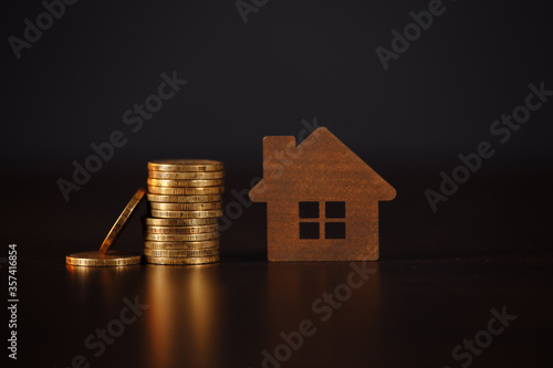 House and coins stack. Mortgage loading real estate property with loan money bank concept