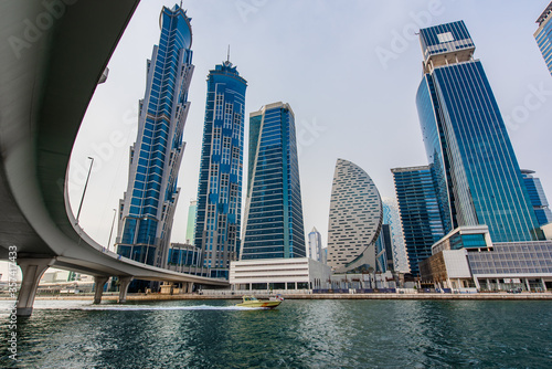 Modern skyscrapers in Dubai. Business bay district. View from water canal. Futuristic architecture. 