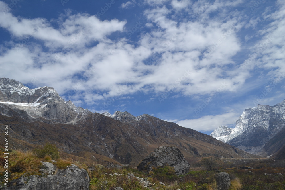 Snow-capped mountains with clear blue skies.