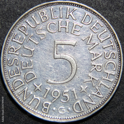 Five Marks silver vintage coin from Germany on black background