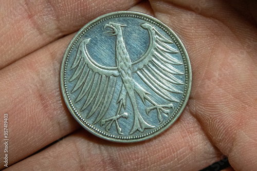Eagle silver coin from Germany in hand