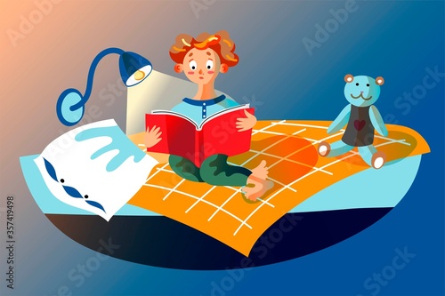 Boy is reading book, sitting on bed in children's bedroom