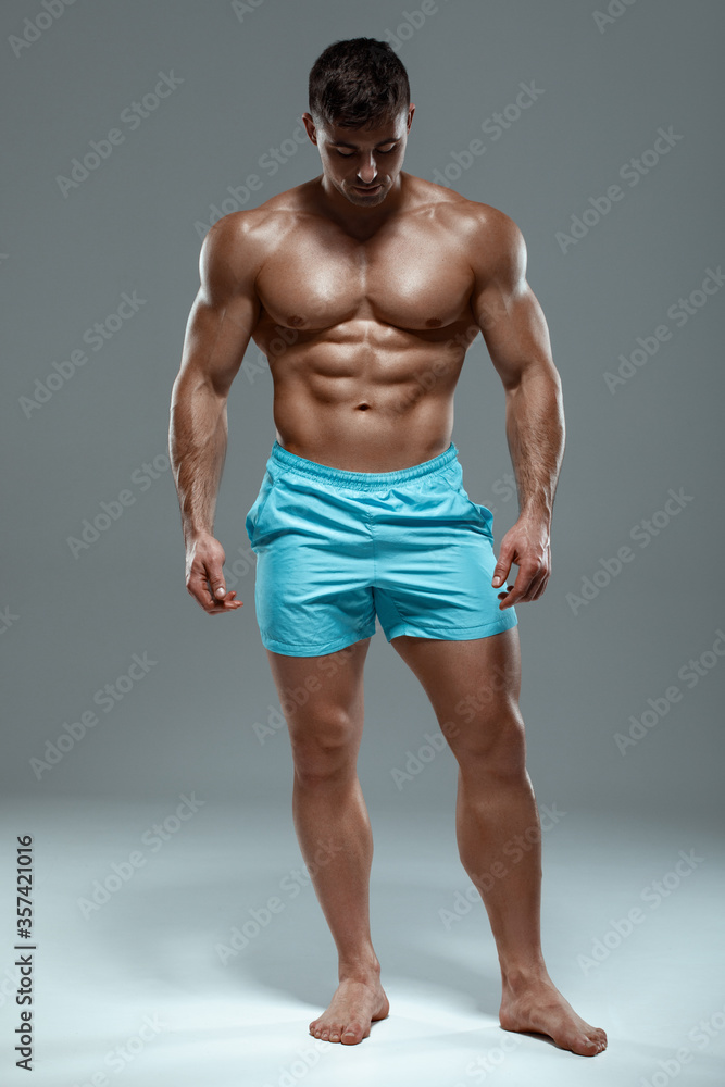 Sexy muscular man fitness model. Strong male naked torso abs