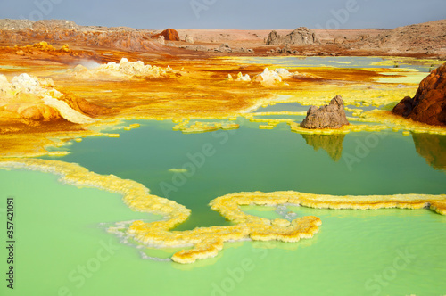 Colorful landscape of green acid ponds in Crater of Dallol Volcano the hottest place year-round on the planet located in Afar region, Danakil Depression, Northern Ethiopia