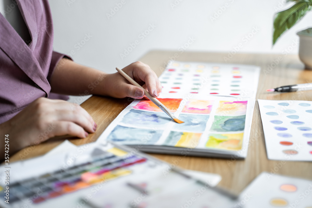 Creative design artist painting colour in art book. Creative design artist painting colour in art book.