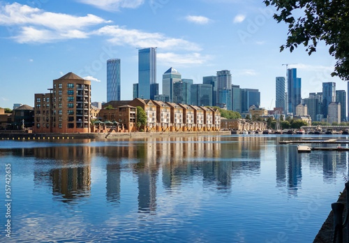 Panorama of Dockland Heritage reflected in the thames River in a sunny day in London photo