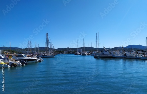 Ibiza, Port of San Antonio - October 16, 2019:boats at sea, mountains in the backround