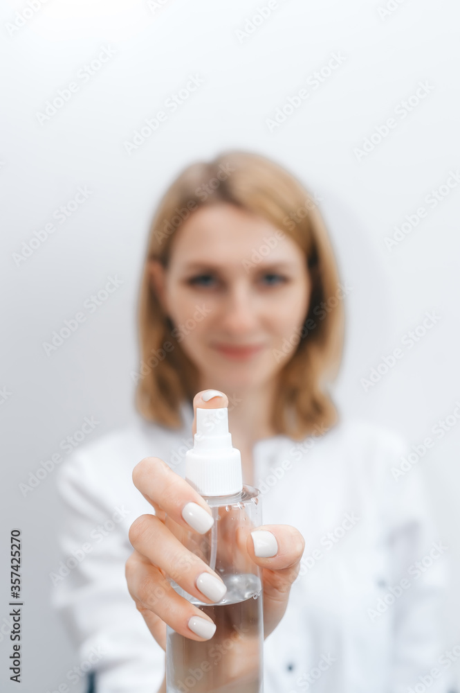 Woman holding antiseptic gel. Closeup. Woman holding antiseptic gel. Closeup.