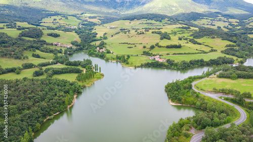 aerial view of basque country reservoir with sierra salvada mountains at background