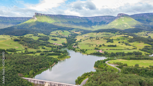 aerial view of basque country reservoir with sierra salvada mountains at background