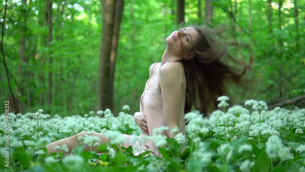 Beautiful Sensual Woman in Forest meadow with Flower Beautiful Sensual Woman in Forest meadow with Flower