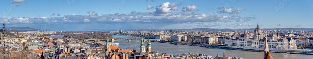 Panoramic view of Budapest Hungary Parliament by Danube river with clouds in winter morning
