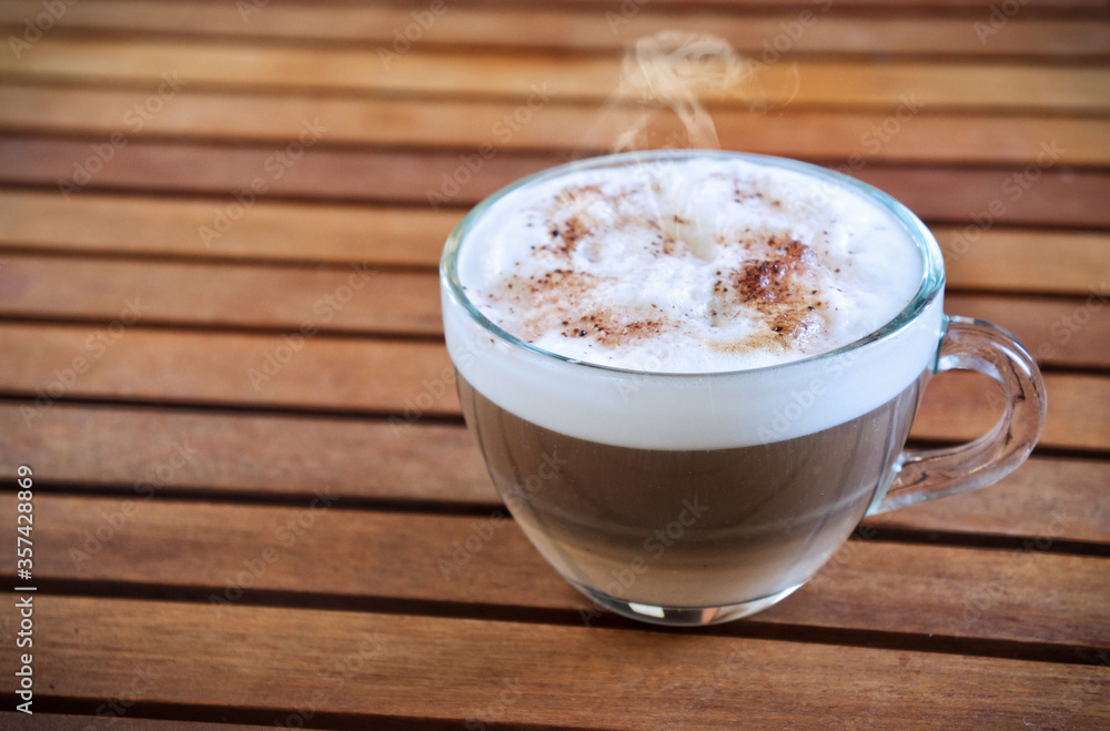 Cappuccino in transparent cup with copy space Cappuccino in transparent cup with copy space