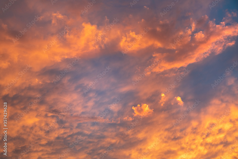 Beautiful bright sunset sky. Dramatic colorful clouds after sunset. Nature backgrounds.