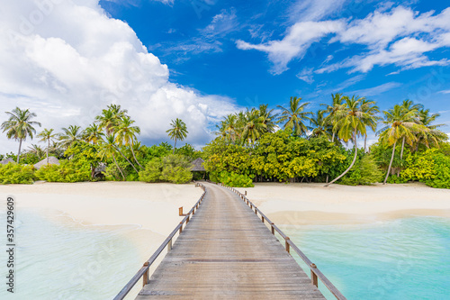 Exotic beautiful beach. Jetty on the sandy beach near the sea. Summer holiday and vacation concept for tourism. Inspirational tropical landscape. Tranquil scenery, relaxing beach, tropical landscape