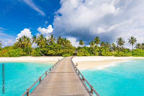 Exotic beautiful beach. Jetty on the sandy beach near the sea. Summer holiday and vacation concept for tourism. Inspirational tropical landscape. Tranquil scenery  relaxing beach  tropical landscape