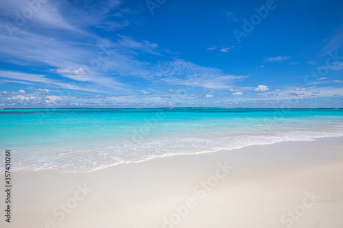 Sea sand sky. Calm relaxing waves on tropical beach. Summer vibes  sea horizon with shades of blue. Empty beach scenery  summer vacation and holiday template. Exotic travel