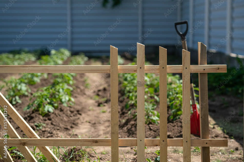 Building a wooden fence. Part of wooden fence. Building a wooden fence. Part of wooden fence.