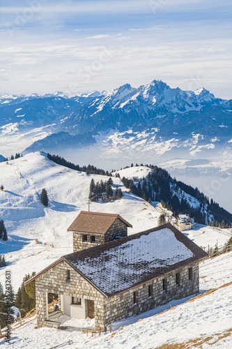 Panoramic view from summit of Mount Rigi, Switzerland in winter with a hose in the foreground