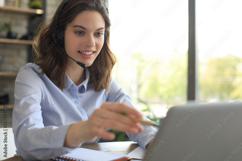 Freelance operator talking with headsets and consulting clients from home office. Freelance operator talking with headsets and consulting clients from home office.