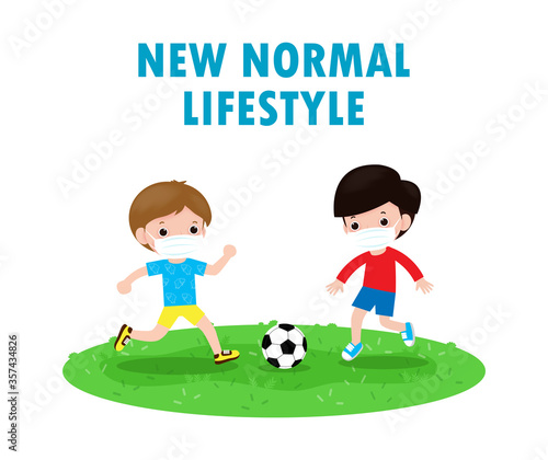 Two little boy wearing face mask playing soccer on new normal lifestyle concept.children playing football and wearing surgical protect Coronavirus 2019-nCoV or covid-19  Health care isolated backgroud