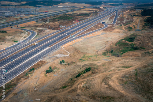 Landing at Turkey airport in Istanbul. Aerial view from airplane of landscape and highway. Amazing infrastructure and poor soil. Wide shot at daylight photo