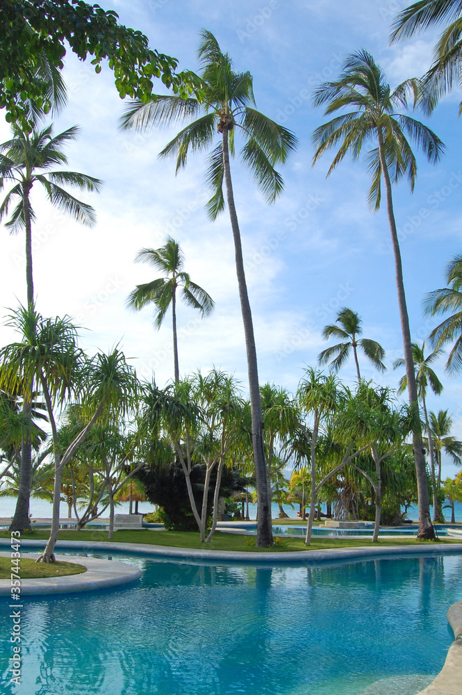 Swimming pool and coconut trees at Dos Palmas island resort in Honda Bay, Puerto Princesa, Palawan, Philippines