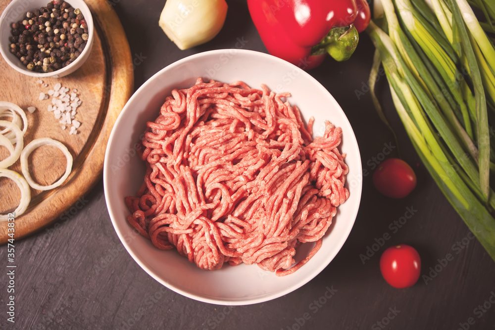 Fresh Raw mince. Minced beef in a white bowl Fresh Raw mince. Minced beef in a white bowl