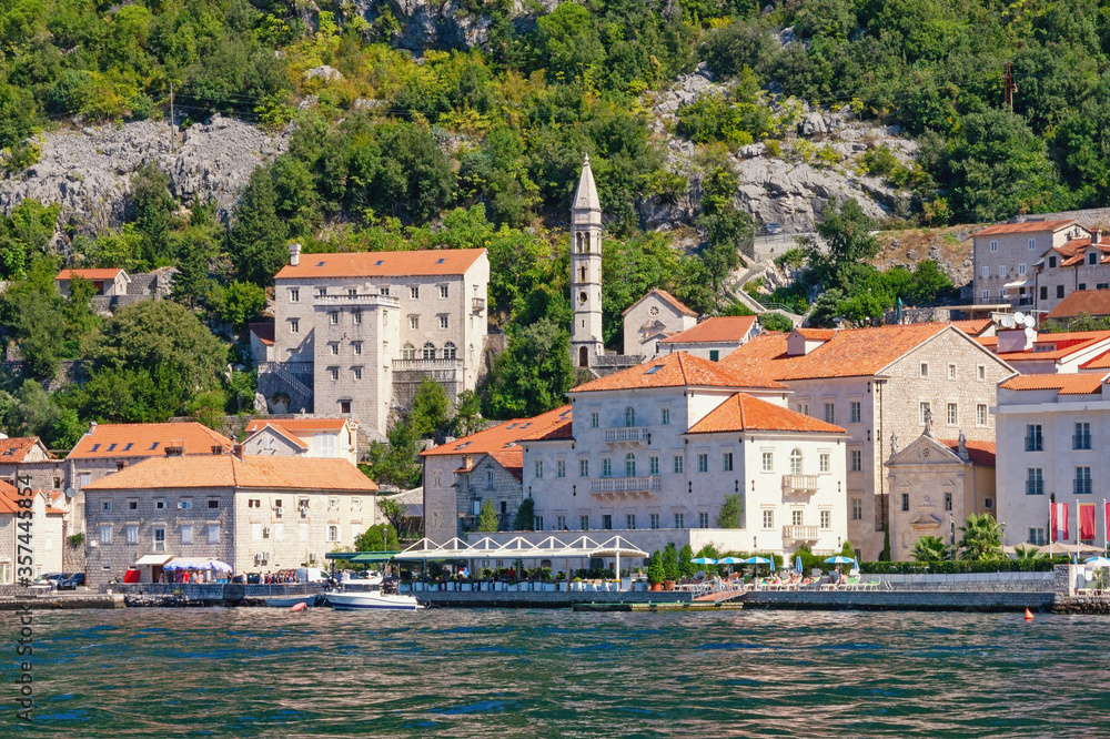 Montenegro. View of ancient town of Perast on sunny autumn day.  Bell tower of Church of Our Lady of Rosary. Adriatic Sea, Kotor Bay