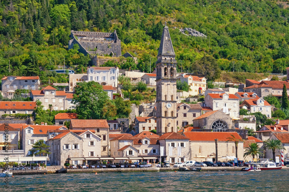 View of ancient town of Perast with bell tower of St Nicholas church on sunny autumn day. Bay of Kotor, Montenegro