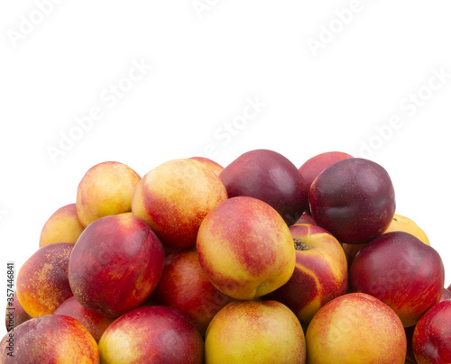 Heap of fresh ripe nectarines isolated on white background