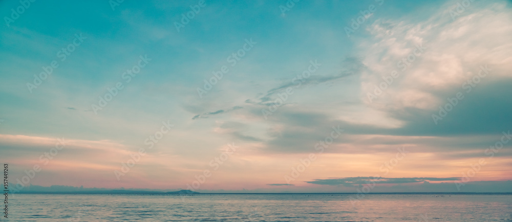beautiful clouds over the sea. seascape, natural minimalistic background and texture, panoramic view banner. pastels tones