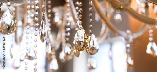 Chrystal chandelier close-up. Glamour background with copy space © whyframeshot