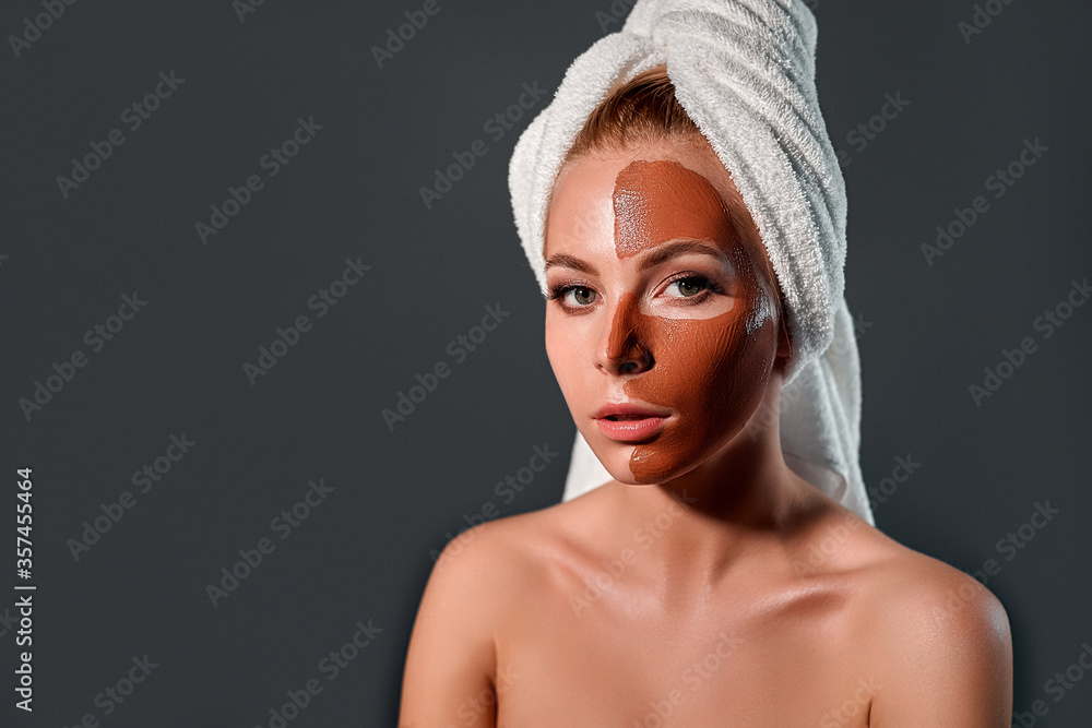 Charming young girl with mask on a gray background. Charming young girl with mask on a gray background.