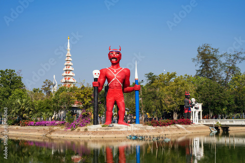 Red giant demon statue in Thai temple photo