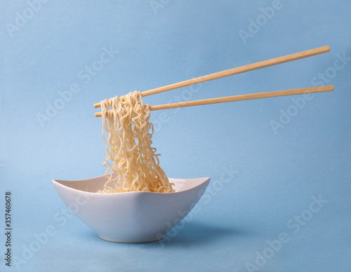 asian traditional dish - noodle ramen with chopsticks photo