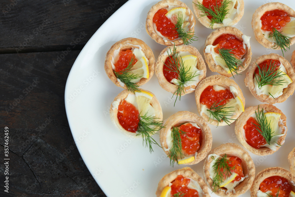 beautiful tasty tartlets with red caviar beautiful tasty tartlets with red caviar
