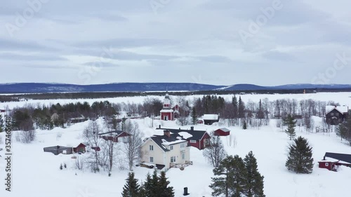 Aerial shot of Jukkasjärvi's church in Kiruna, Swedish Lapland. Winter.